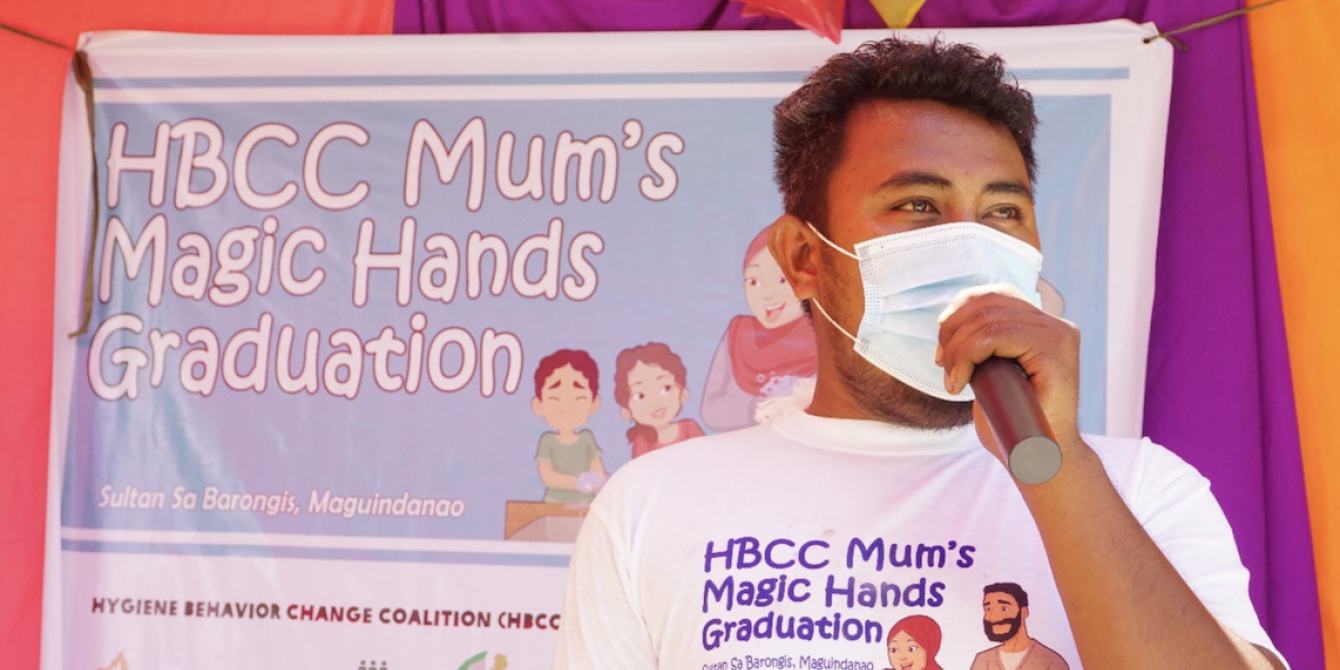 Morodin discusses the importance of frequent and proper handwashing in front of community members during the Mum's Magic Hands Graduation at Sultan sa Barongis, Maguindanao. The 'graduates' are expected to become health champions within their communities and ensure the project's sustainability. (Photo: IDEALS) Morodin discusses the importance of frequent and proper handwashing in front of community members during the Mum's Magic Hands Graduation at Sultan sa Barongis, Maguindanao. The 'graduates' are expected to become health champions within their communities and ensure the project's sustainability. (Photo: IDEALS)